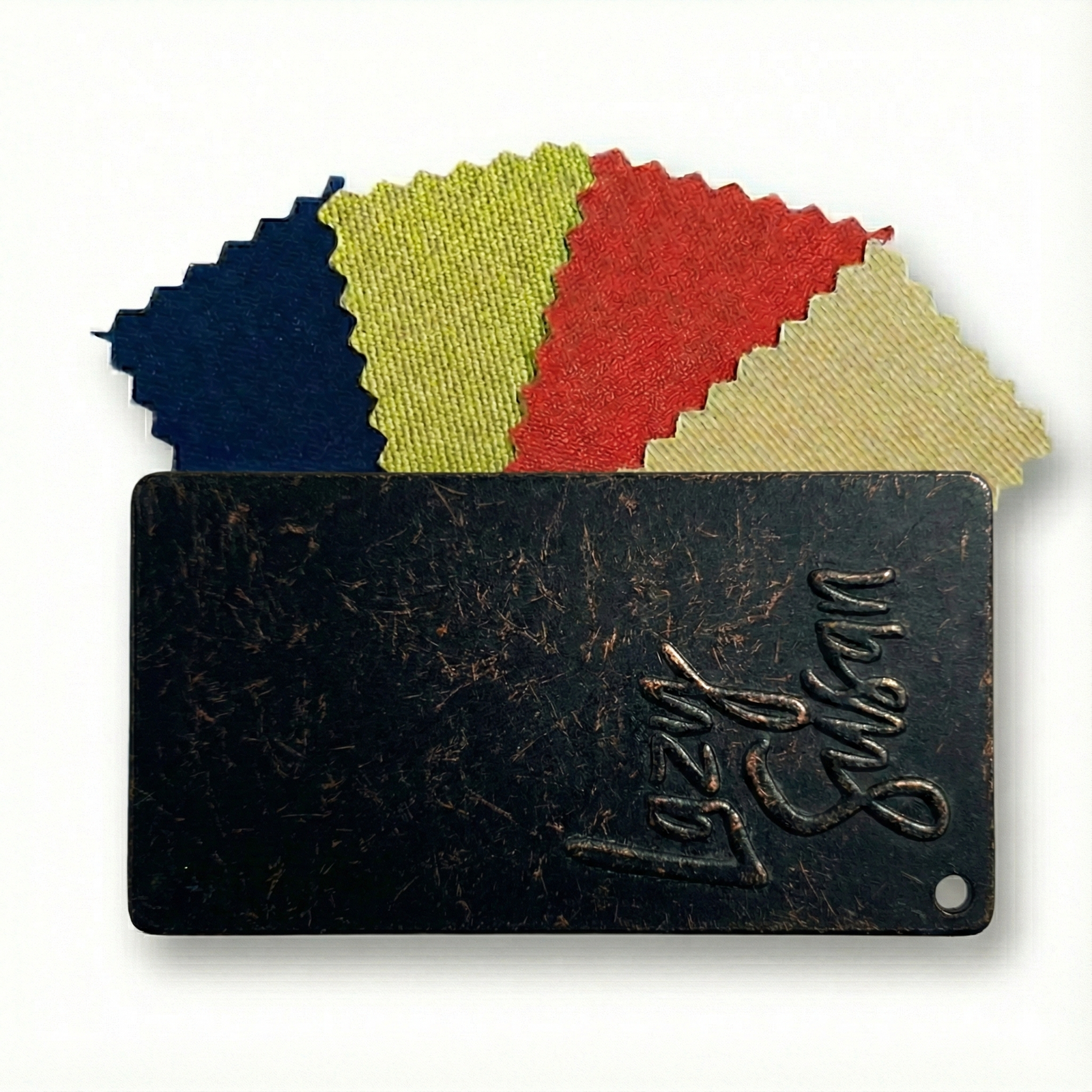 Black and bronze metal swatch with colorful fabric swatches on a white background