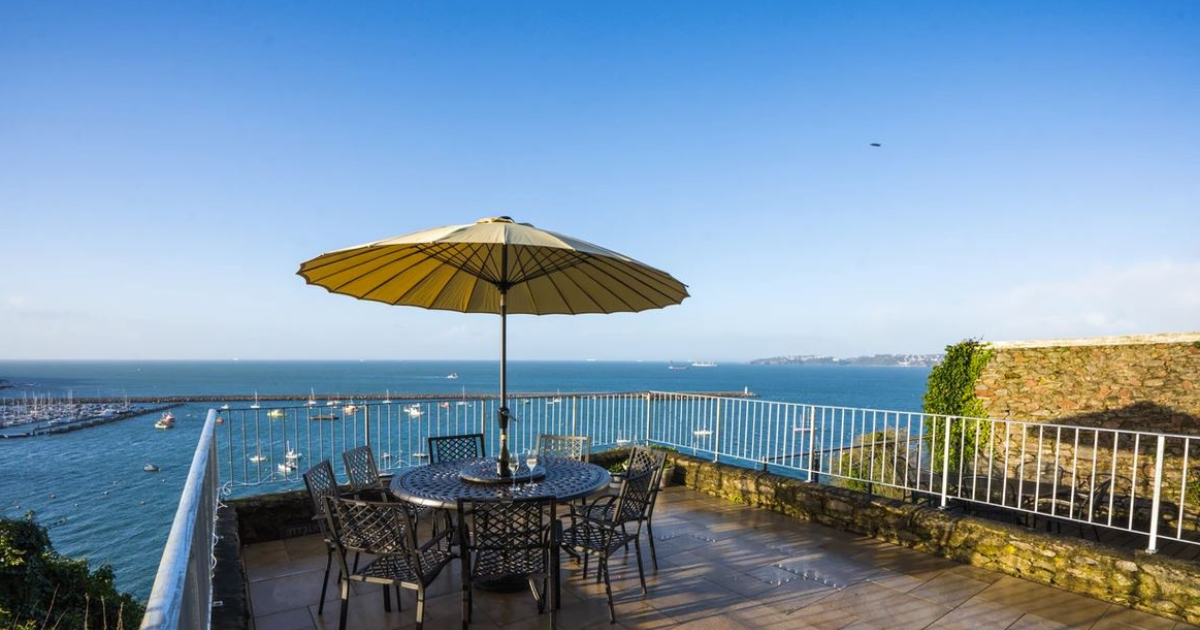 Lazy susan outdoor dining set with parasol on the Mouette hotel terrace