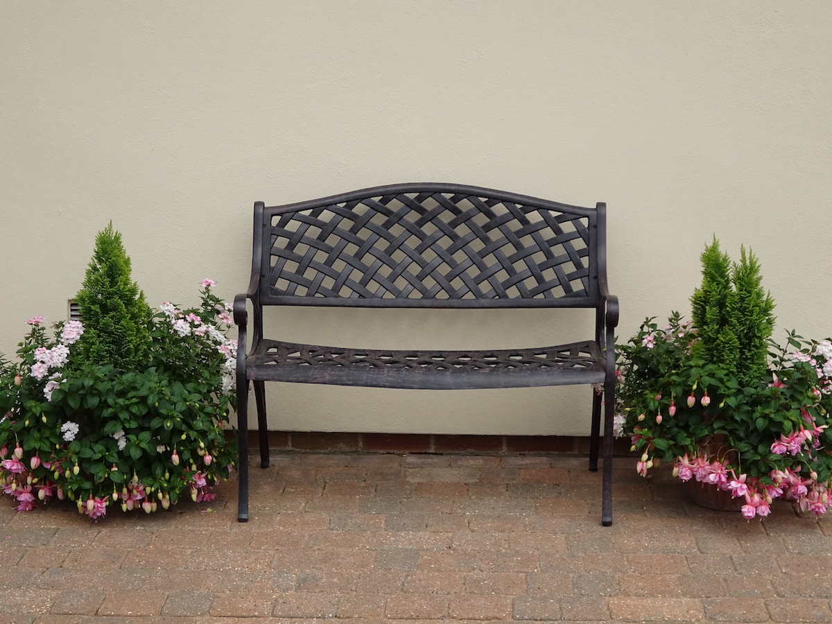 How to incorporate planting around your garden bench