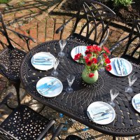 Preview: Close up the June 6 seater garden table and April chairs in antique bronze