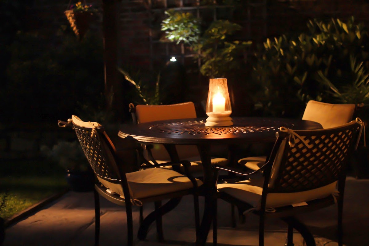 Our top outdoor furniture lighting tips | Lantern on our Amy 4-seater table