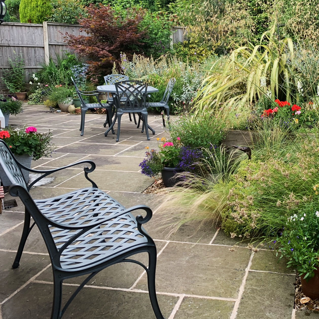 Our Jasmine Bench and June Garden Table set don't overpower this space but draw you into the garden