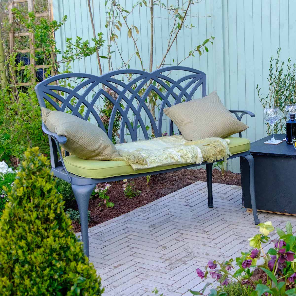 What are the advantages of putting a bench in your outdoor space?