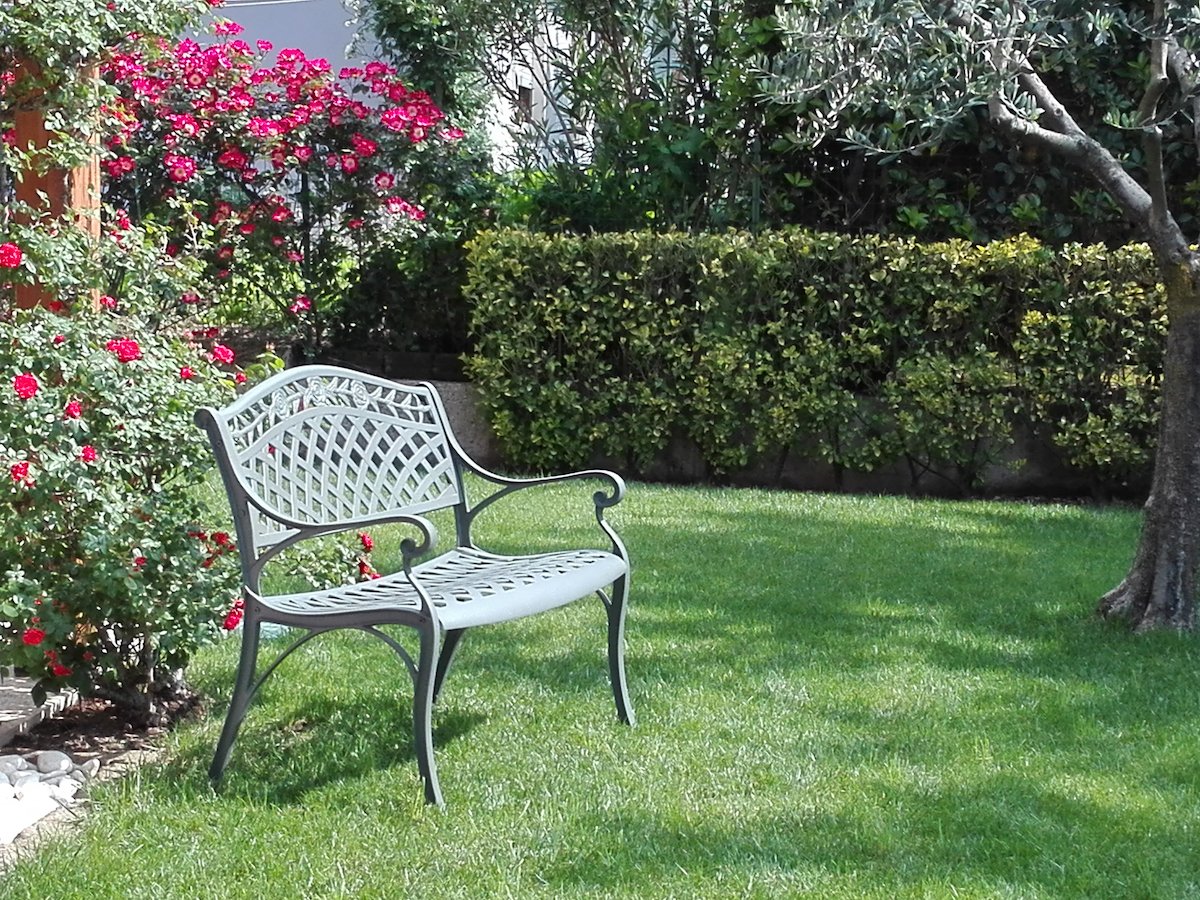 How do you create a focal point with a garden bench?